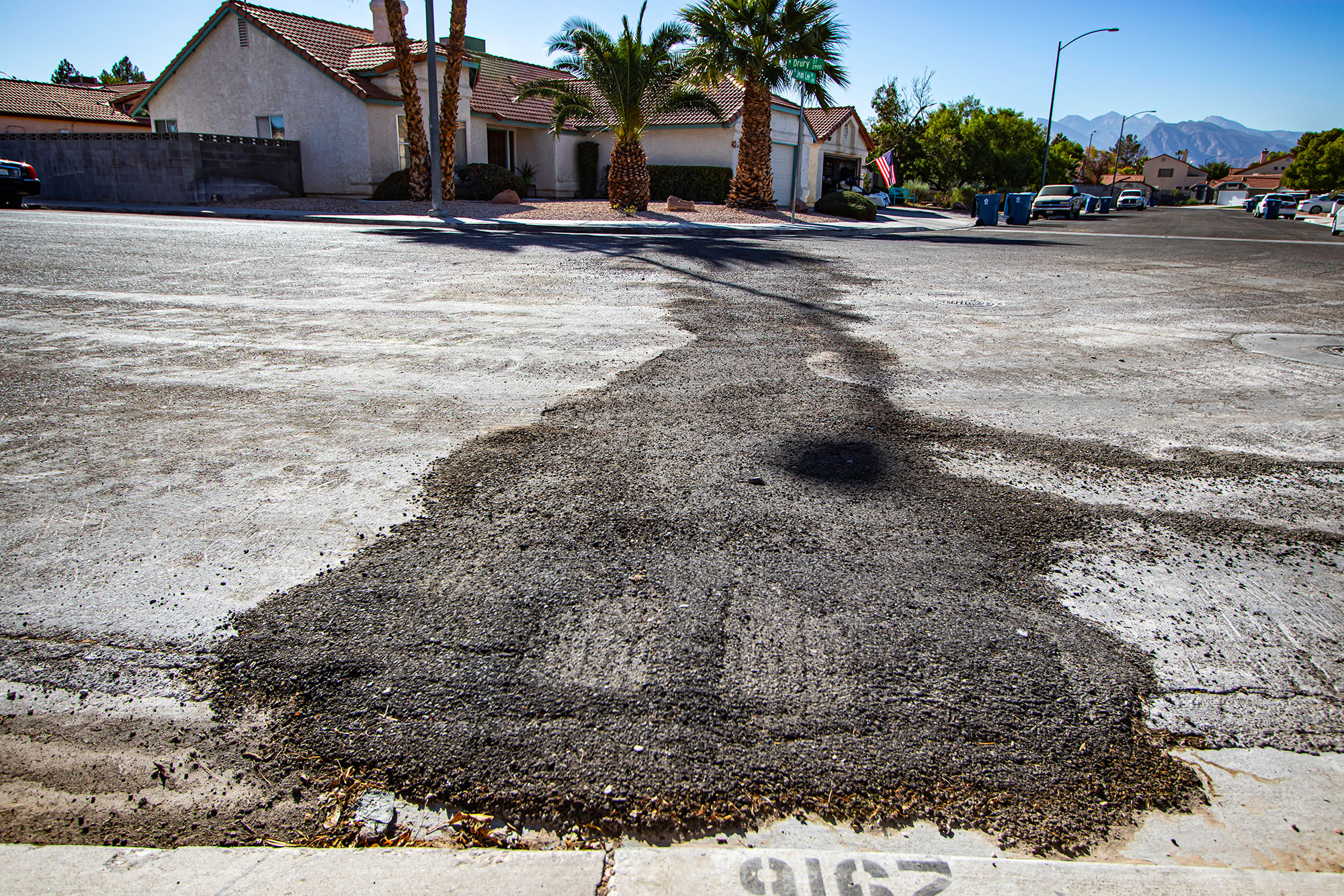 Temporary asphalt patch looks messy, unfinished