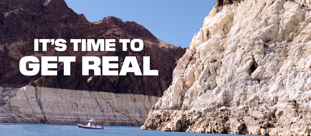Boat on Lake Mead with the so-called bathtub ring prominently displayed. Text overlaying the image reads It's Time To Get Real.