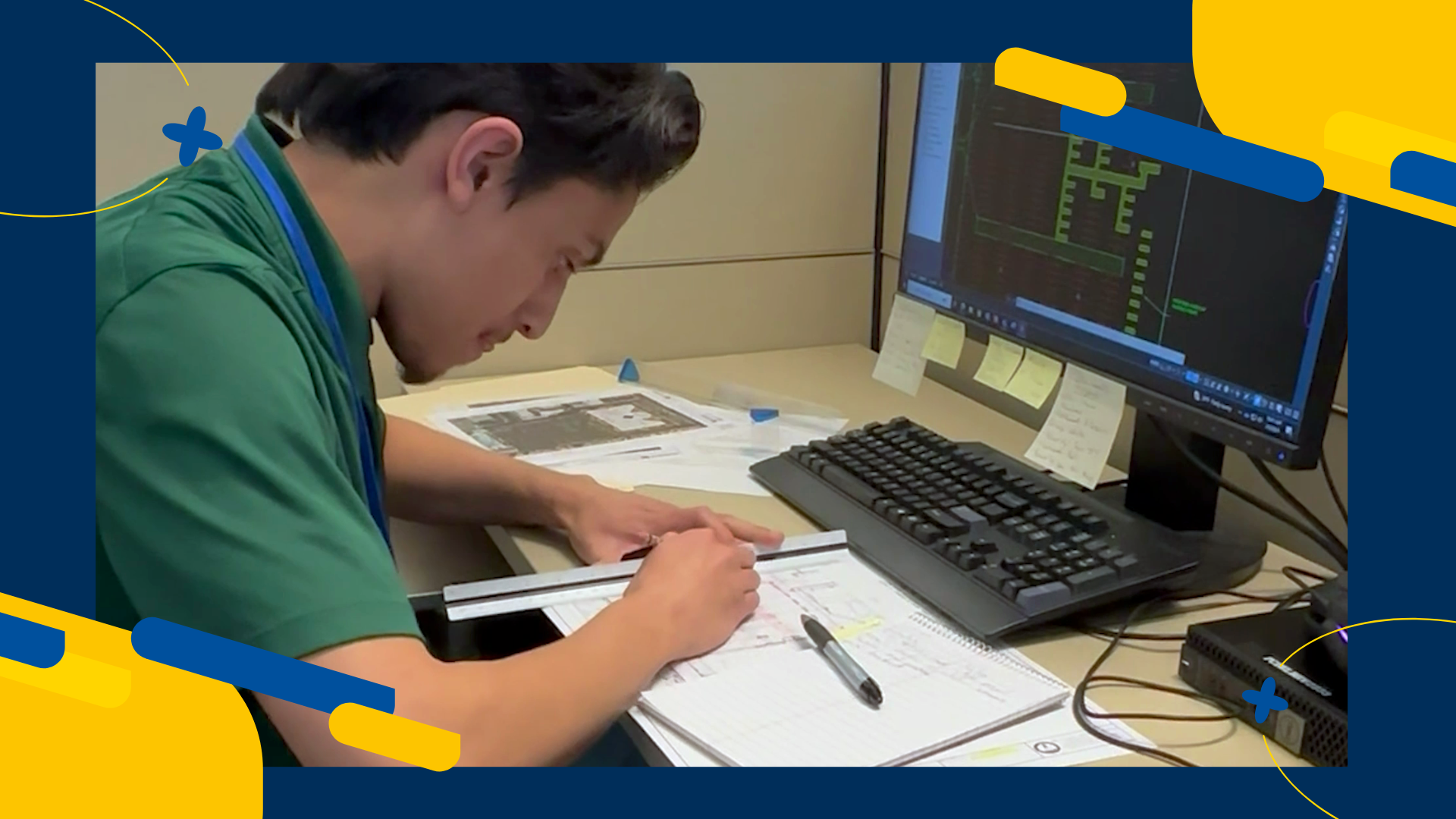 Intern using ruler to draw plans.