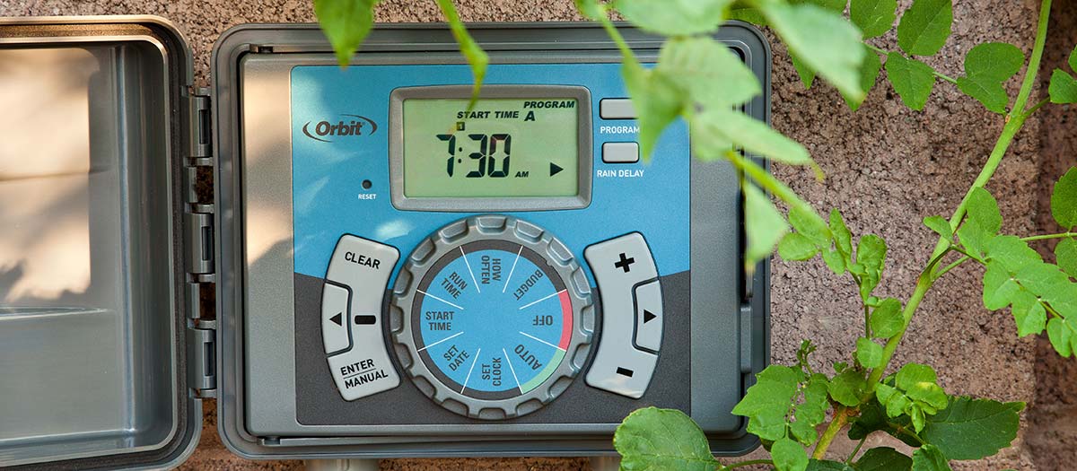 Irrigation clock surrounded by leaves