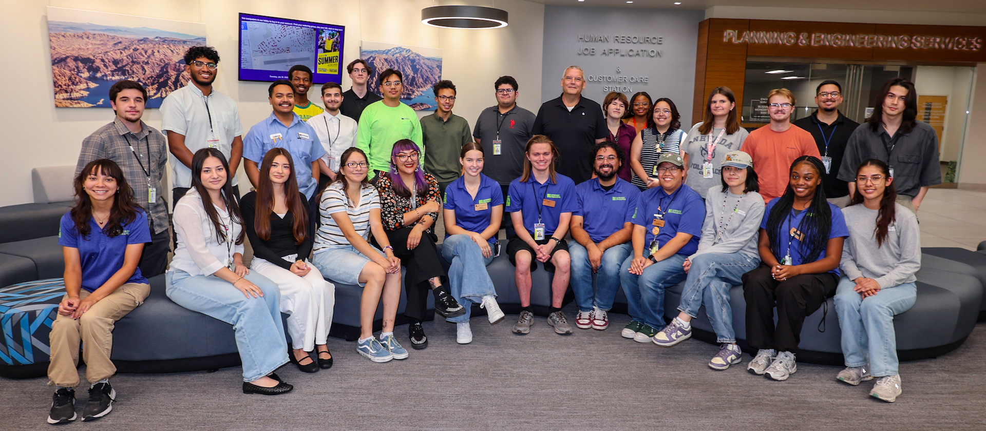 A group of interns posing with the General Manager.
