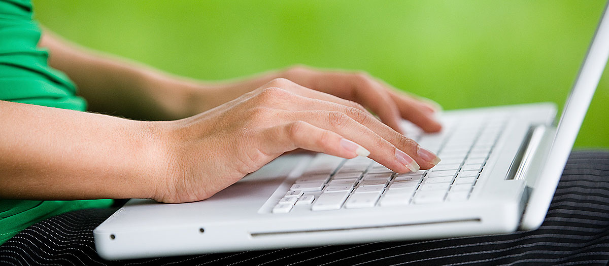 a person using a laptop computer