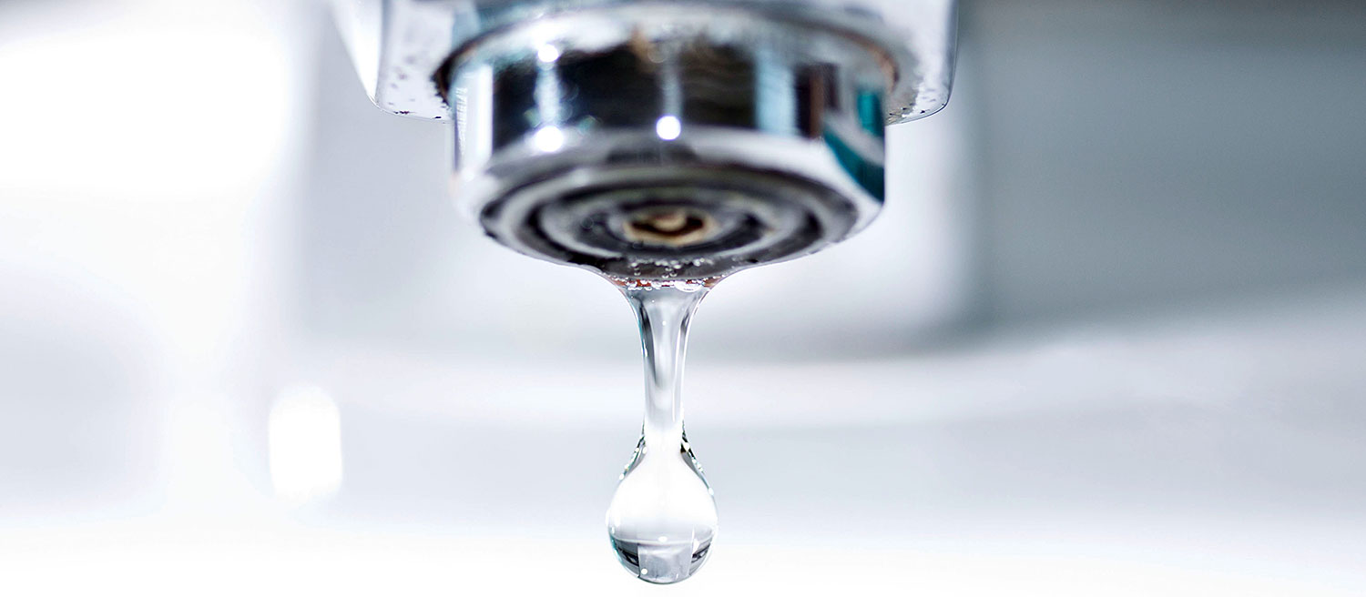 Water drips from a faucet